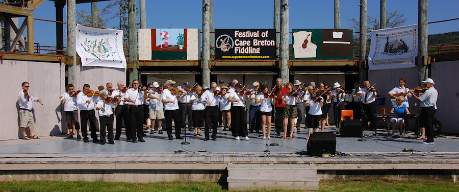 [dsc_5734.jpg] Cape Breton Fiddlers’ Association second group number directed by Eddie Rodgers and accompanied by Betty Lou Beaton on keyboards