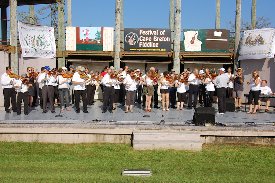 [dsc_5941.jpg] Cape Breton Fiddlers’ Association third group number, a tribute to the deceased members, directed by Eddie Rodgers and accompanied by Sheumas MacNeil on keyboards