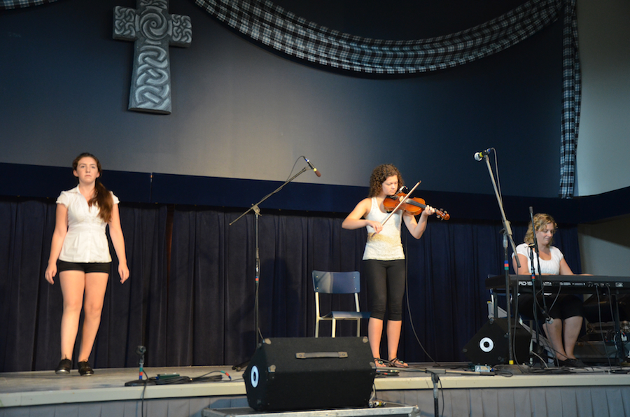 Natalie DeCoste step-dancing to the music of Michaela Bourgeron on fiddle and Leanne Aucoin on keyboards