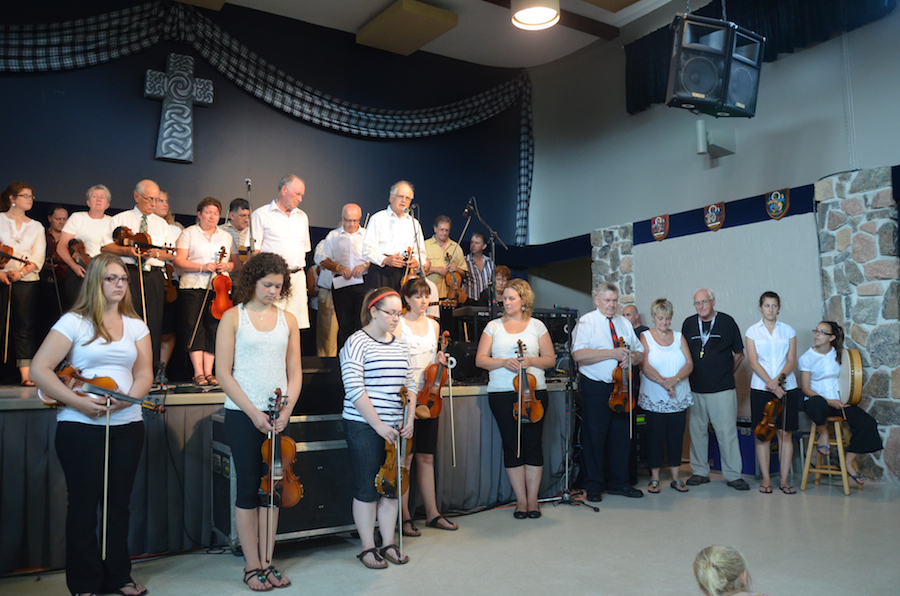 The Cape Breton Fiddlers’ Association members during the tribute prayer