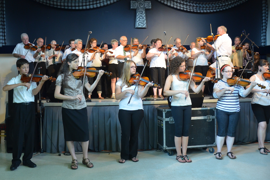 Cape Breton Fiddlers’ Association Second Group Number, directed by Eddie Rogers and accompanied by Janet Cameron on keyboards and James Boudreau on guitar