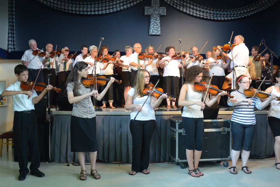 Cape Breton Fiddlers’ Association Second Group Number, directed by Eddie Rogers and accompanied by Janet Cameron on keyboards and James Boudreau on guitar
