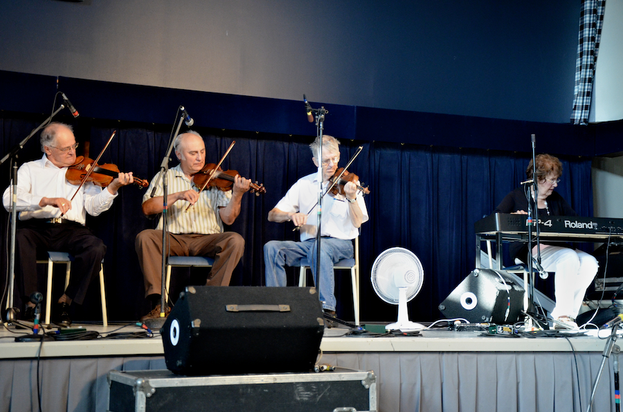 The Boisdale Trio of Fiddlers (Father Francis Cameron, Paul Wukitsch, and Joe Peter MacLean) accompanied by Janet Cameron on keyboards