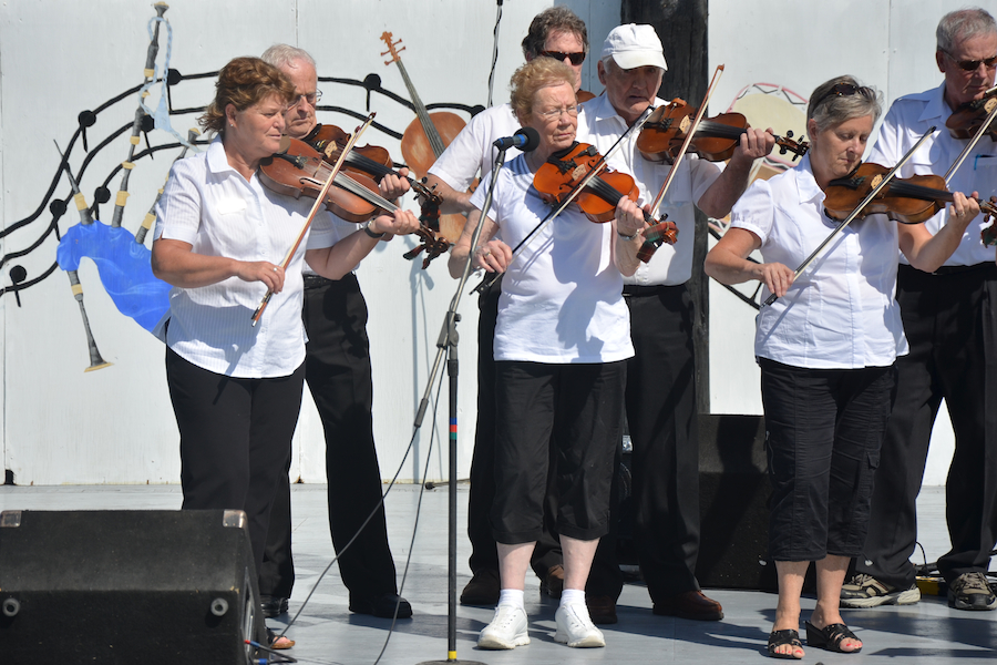 The Prince Edward Island Fiddlers directed by Kathryn Dau-Schmidt and accompanied by Marion Pirch on keyboard