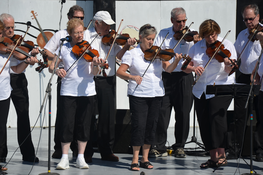 The Prince Edward Island Fiddlers directed by Kathryn Dau-Schmidt and accompanied by Marion Pirch on keyboard