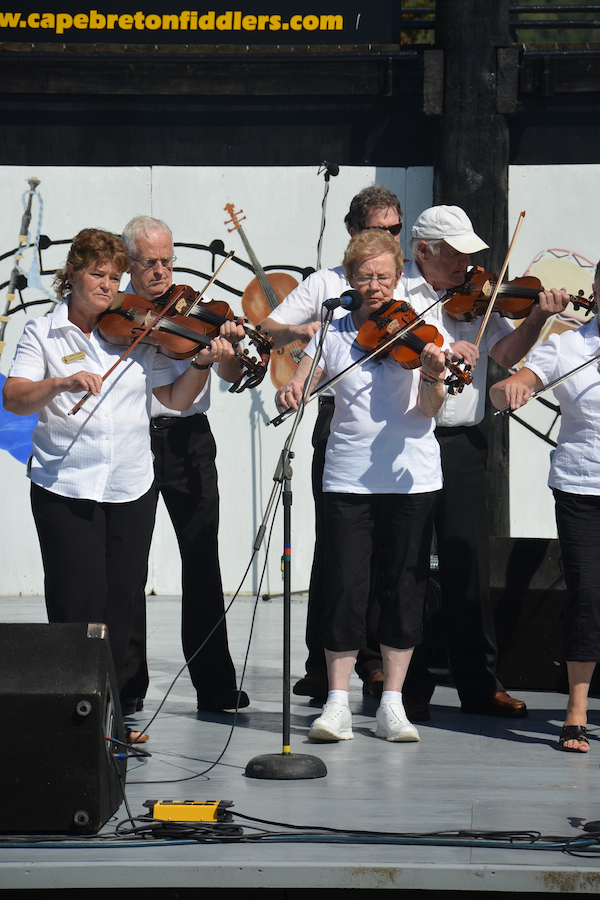 The Prince Edward Island Fiddlers directed by Kathryn Dau-Schmidt and accompanied by Marion Pirch on keyboard