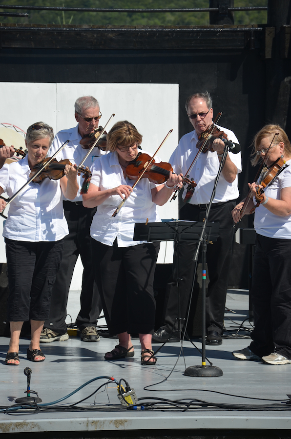 The Prince Edward Island Fiddlers directed by Kathryn Dau-Schmidt and accompanied by Marion Pirch on keyboard