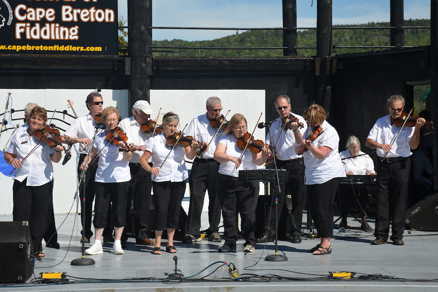 The Prince Edward Island Fiddlers directed by Kathryn Dau-Schmidt and accompanied by Marion Pirch on keyboard