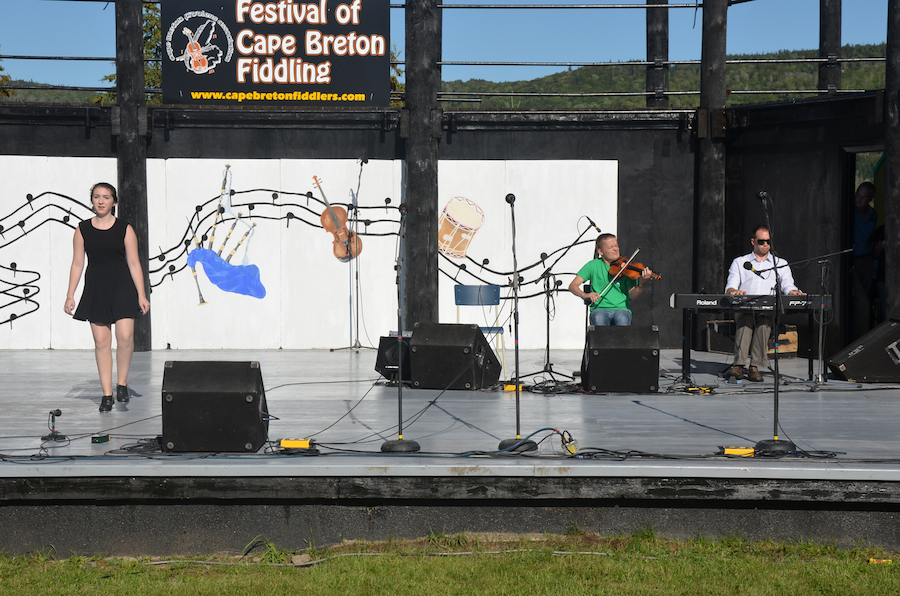 Natalie DeCoste step‑dancing to the music of Kirill Raskolenko on fiddle and Kolten Macdonell on keyboard