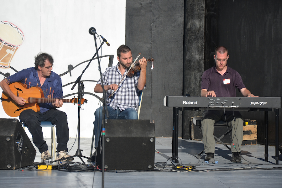 Brent Aucoin on fiddle, accompanied by Mike Hall on keyboard, and Paul MacDonald on guitar