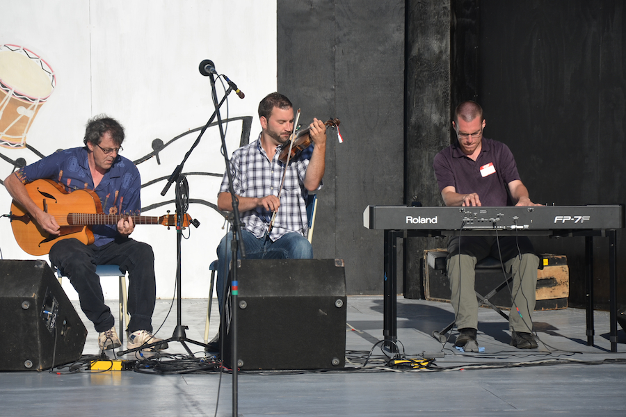 Brent Aucoin on fiddle, accompanied by Mike Hall on keyboard, and Paul MacDonald on guitar