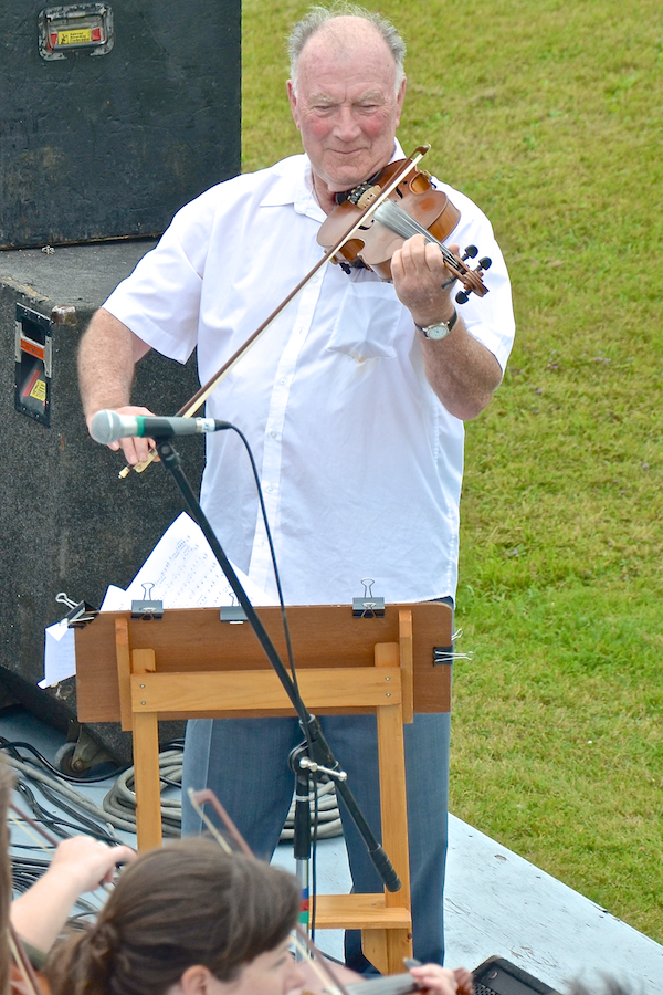 Eddie Rogers directing and on fiddle