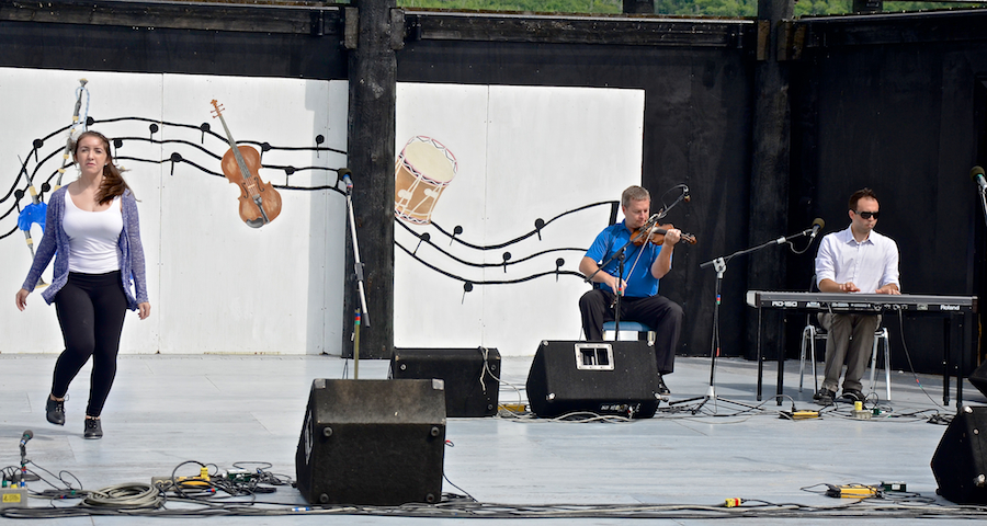 Natalie DeCoste step‑dancing to the music of Rodney MacDonald on fiddle and Kolten MacDonell on keyboard