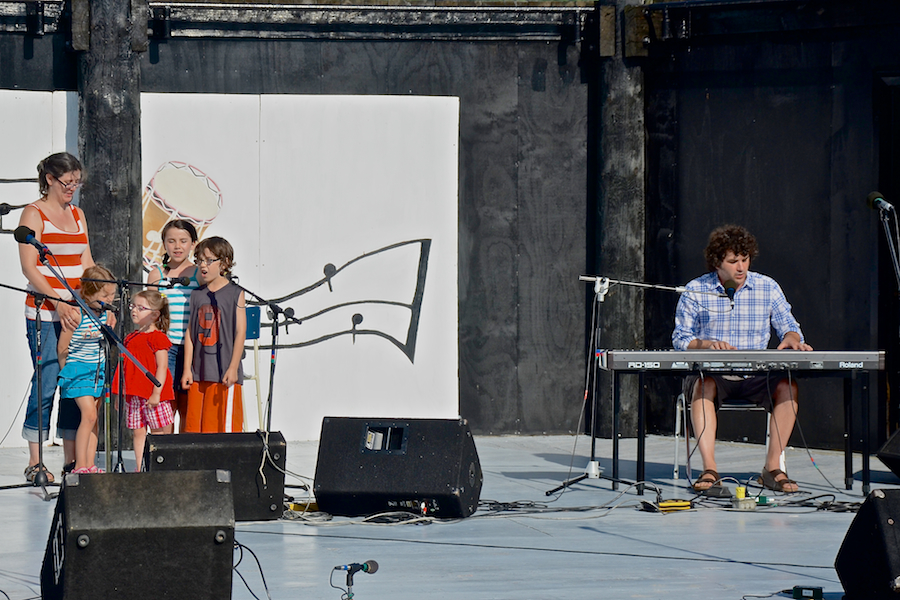 The Gallant family sings a song accompanied by Gary Gallant on keyboard