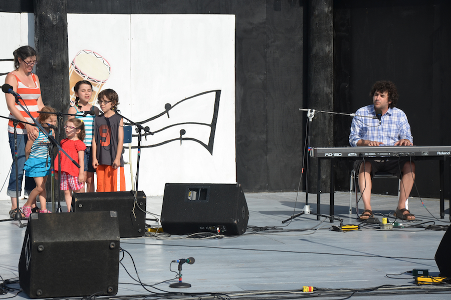The Gallant family sings a song accompanied by Gary Gallant on keyboard