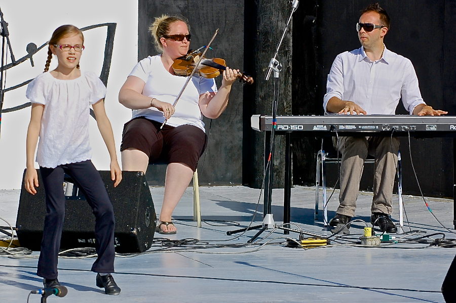 Drea Shepherd step‑dancing to the music of Dara MacDonald on fiddle and Kolten MacDonell on keyboard