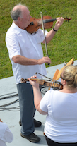 Eddie Rogers on fiddle and directing