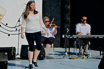 Kayla Marchand step‑dancing to the music of Dara MacDonald on fiddle and Kolten MacDonell on keyboard