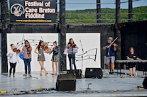 Kyle MacNeil with five of his students on fiddle accompanied by Susan MacLean on keyboard