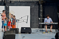 The Gallant family sings a song accompanied by Gary Gallant on keyboard