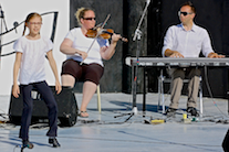 Drea Shepherd step‑dancing to the music of Dara MacDonald on fiddle and Kolten MacDonell on keyboard