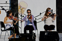 Michaela Forgeron, Natalie DeCoste, and Kayla Marchand on fiddles