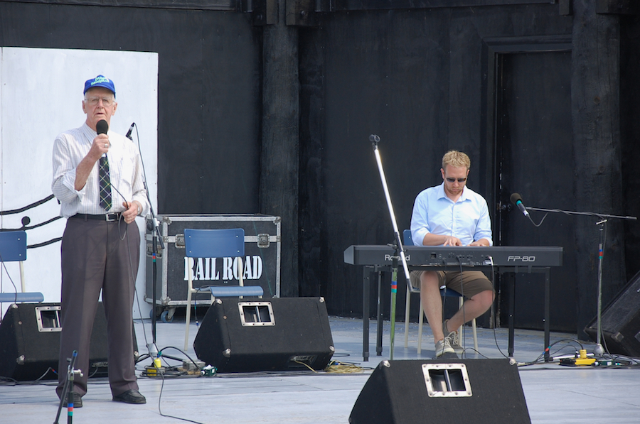 Joe MacNeil singing Away from the Roll of the Sea, accompanied by Adam Young on keyboard