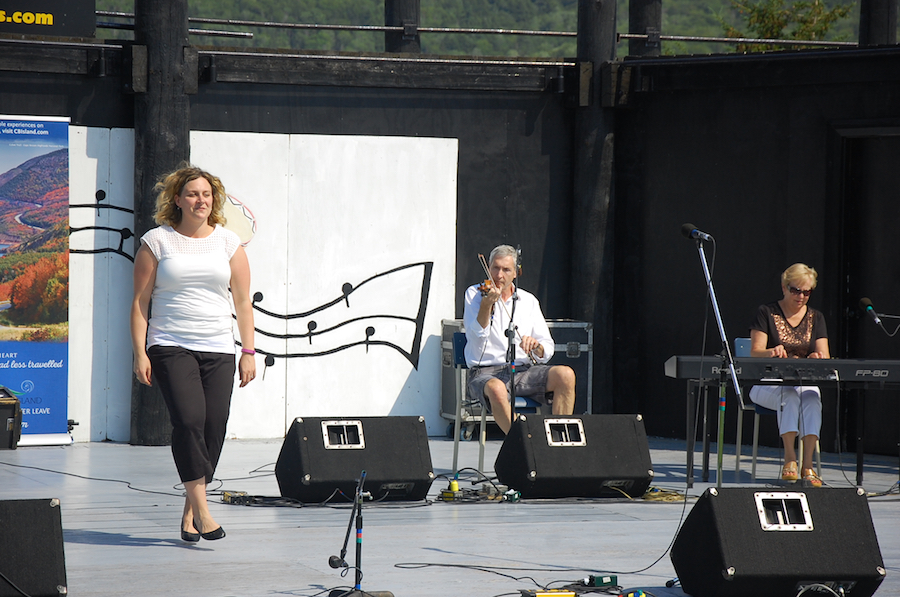 Leanne Aucoin step‑dancing to the music of Kinnon Beaton on fiddle and Betty Lou Beaton on keyboard