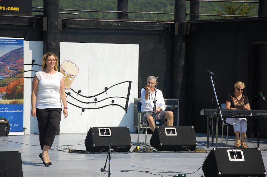 Leanne Aucoin step‑dancing to the music of Kinnon Beaton on fiddle and Betty Lou Beaton on keyboard