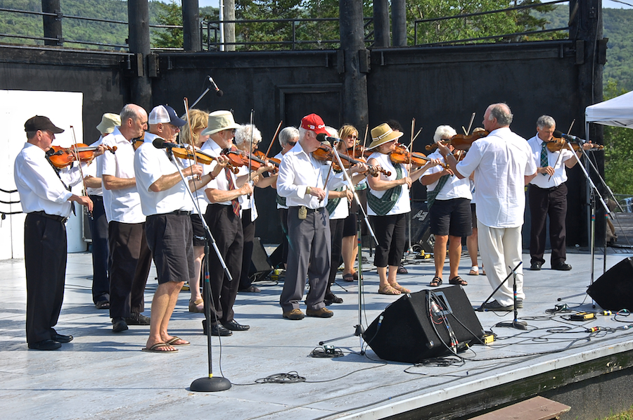 The Feisty Fiddlers— The Cape Breton University Seniors Fiddling Group, directed by Eddie Rogers and accompanied by Leanne Aucoin on keyboard