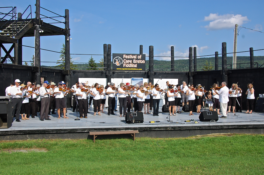 The Cape Breton Fiddlers’ Association plays a set in tribute, directed by Eddie Rogers and accompanied by Betty Lou Beaton on keyboard