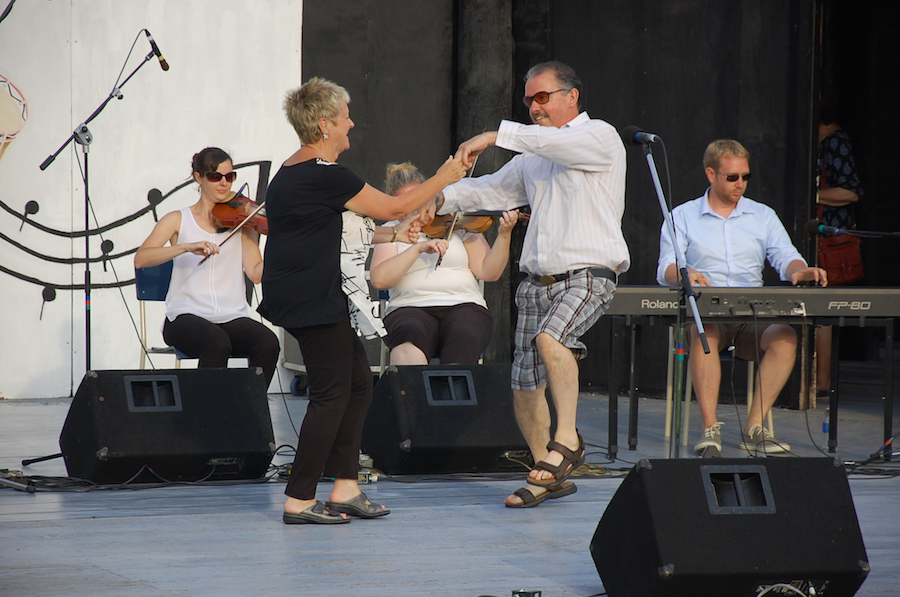 Betty Matheson and Larry Parks do a celebratory step dance