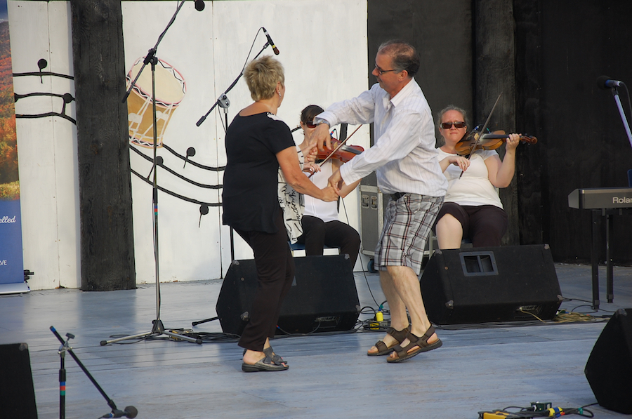 Betty Matheson and Larry Parks do a celebratory step dance
