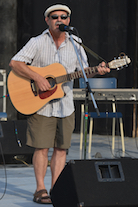 Mario Colosimo singing to his own guitar accompaniment