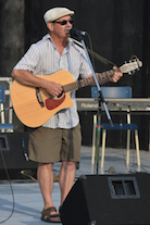 Mario Colosimo singing to his own guitar accompaniment
