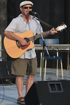 Mario Colosimo singing to his own guitar accompaniment