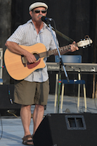 Mario Colosimo singing to his own guitar accompaniment