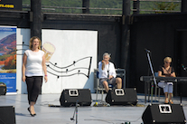 Leanne Aucoin step‑dancing to the music of Kinnon Beaton on fiddle and Betty Lou Beaton on keyboard