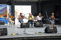 Lorraine Lynch, Marlene Gallant, Father Charlie Cheverie, and Linda Jensen-Moran on fiddles, accompanied by Betty Lou Beaton on keyboard