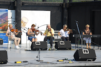 Lorraine Lynch, Marlene Gallant, Father Charlie Cheverie, and Linda Jensen-Moran on fiddles, accompanied by Betty Lou Beaton on keyboard