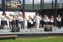 The Feisty Fiddlers— The Cape Breton University Seniors Fiddling Group, directed by Eddie Rogers and accompanied by Leanne Aucoin on keyboard