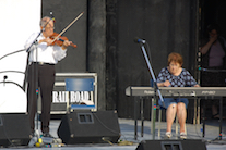 Father Francis Cameron on fiddle accompanied by Janet Cameron on keyboard