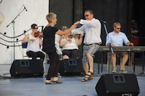 Betty Matheson and Larry Parks do a celebratory step dance