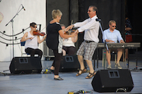Betty Matheson and Larry Parks do a celebratory step dance