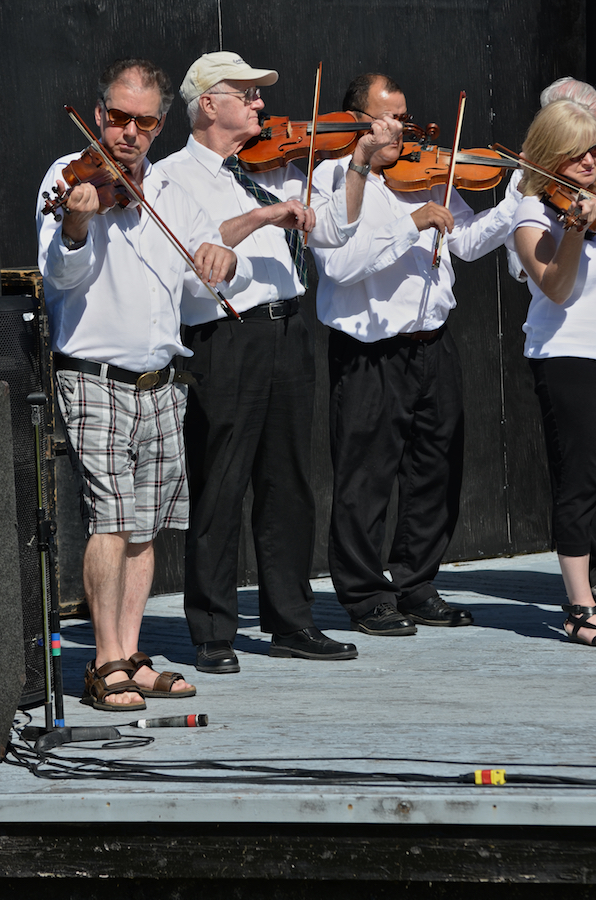 The Cape Breton Fiddlers’ Association plays its second group number in tribute