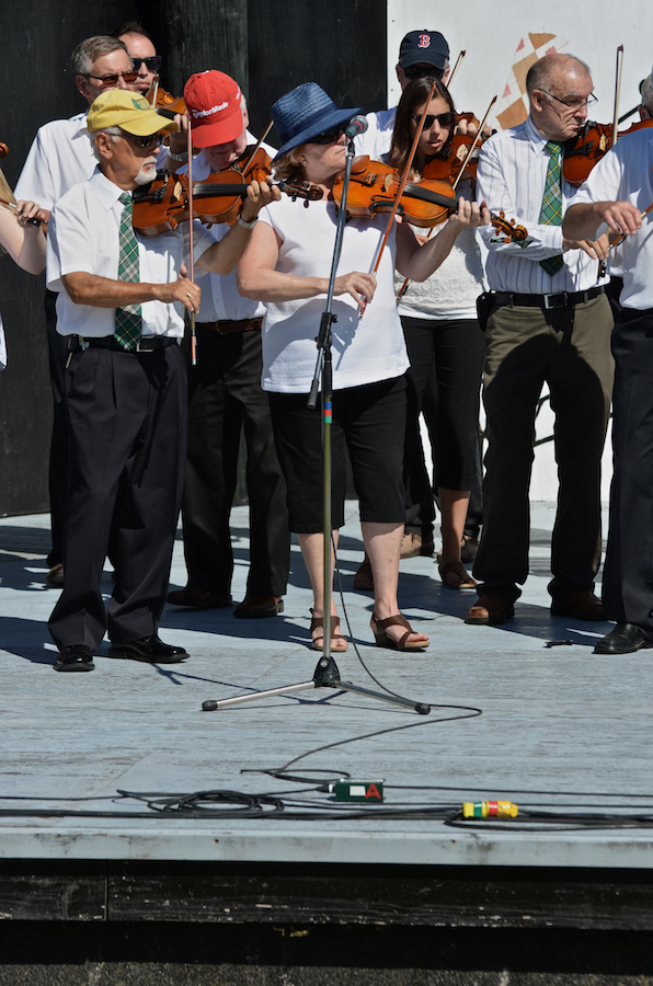 The Cape Breton Fiddlers’ Association plays its second group number in tribute