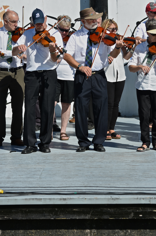 The Cape Breton Fiddlers’ Association plays its second group number in tribute
