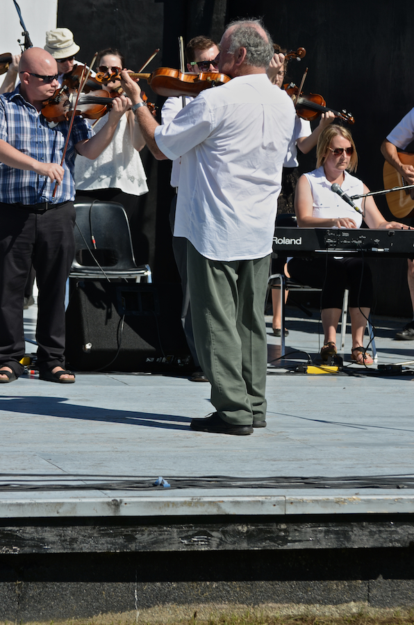 The Cape Breton Fiddlers’ Association plays its second group number in tribute