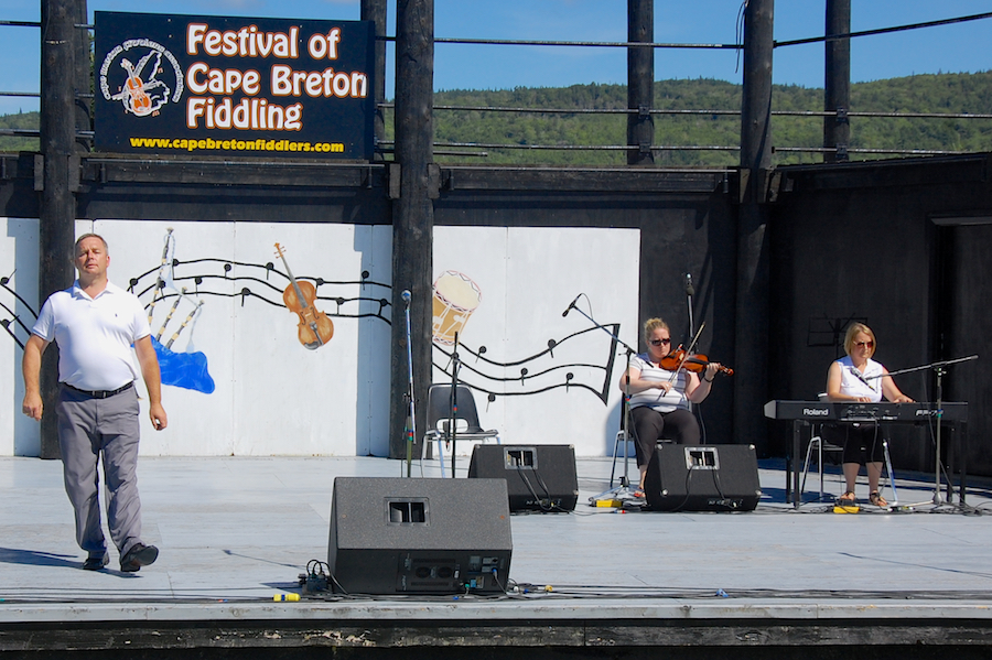 Rodney MacDonald step‑dancing to the music of Dara Smith-MacDonald on fiddle and Susan MacLean on keyboard
