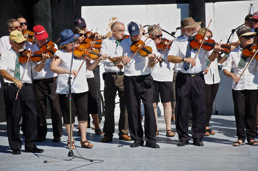 The Cape Breton Fiddlers’ Association plays its second group number in tribute